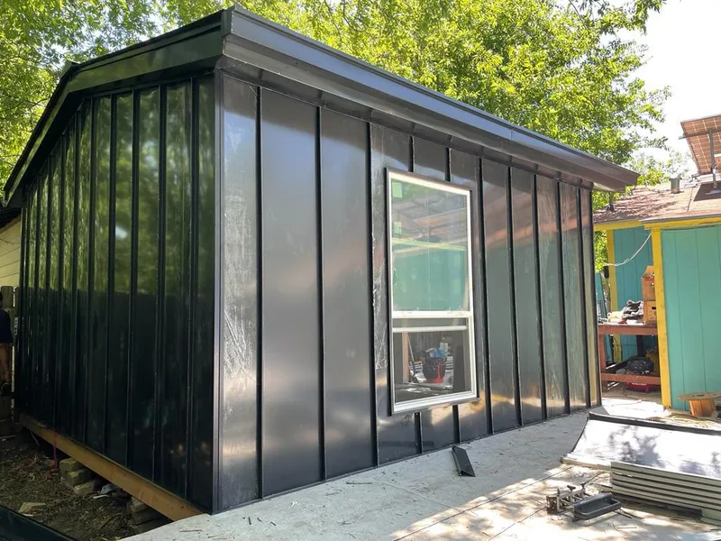 Black standing seam metal wall panels for Roof Inspection in Clifton